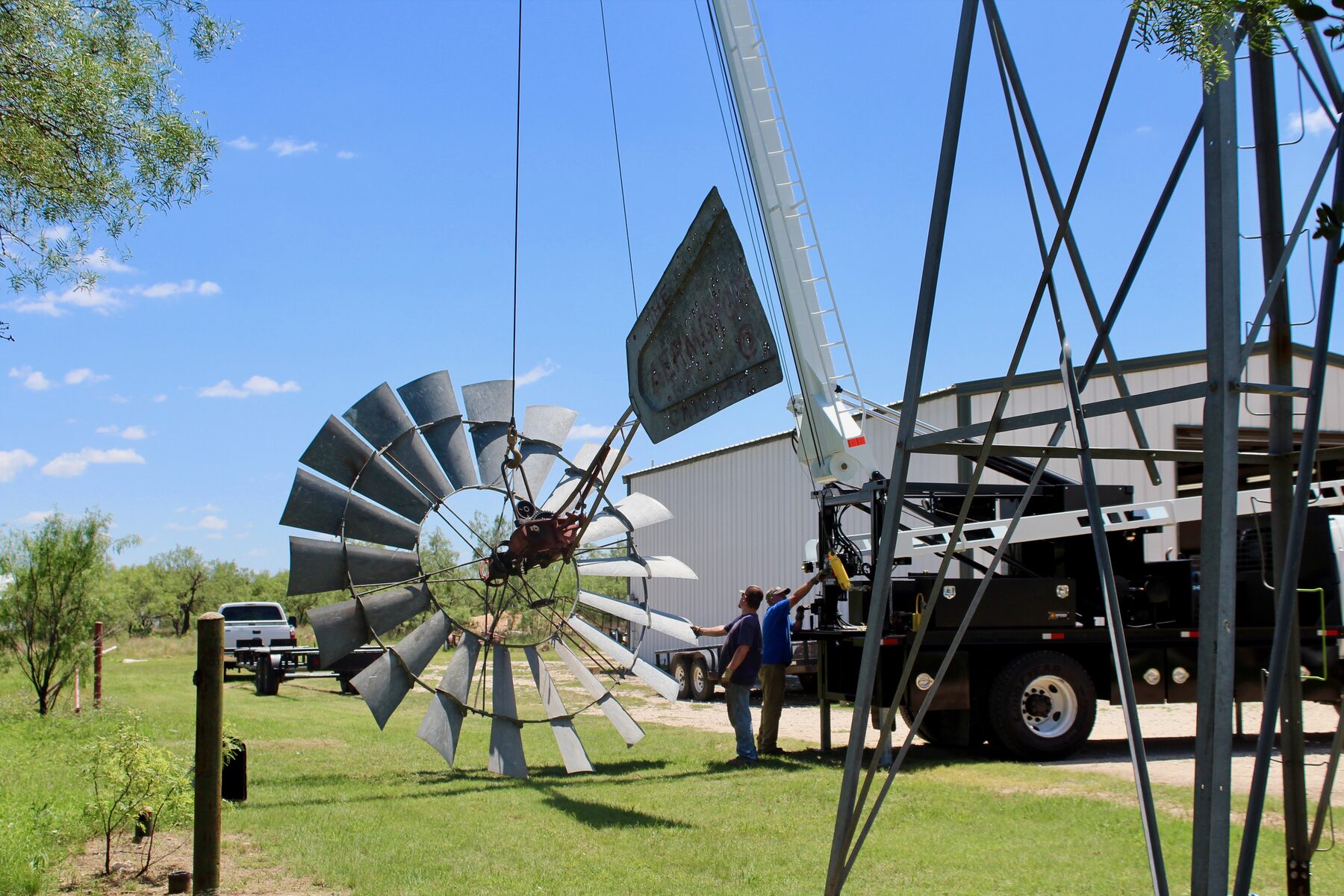 Concho Windmill service truck beside windmill equipment