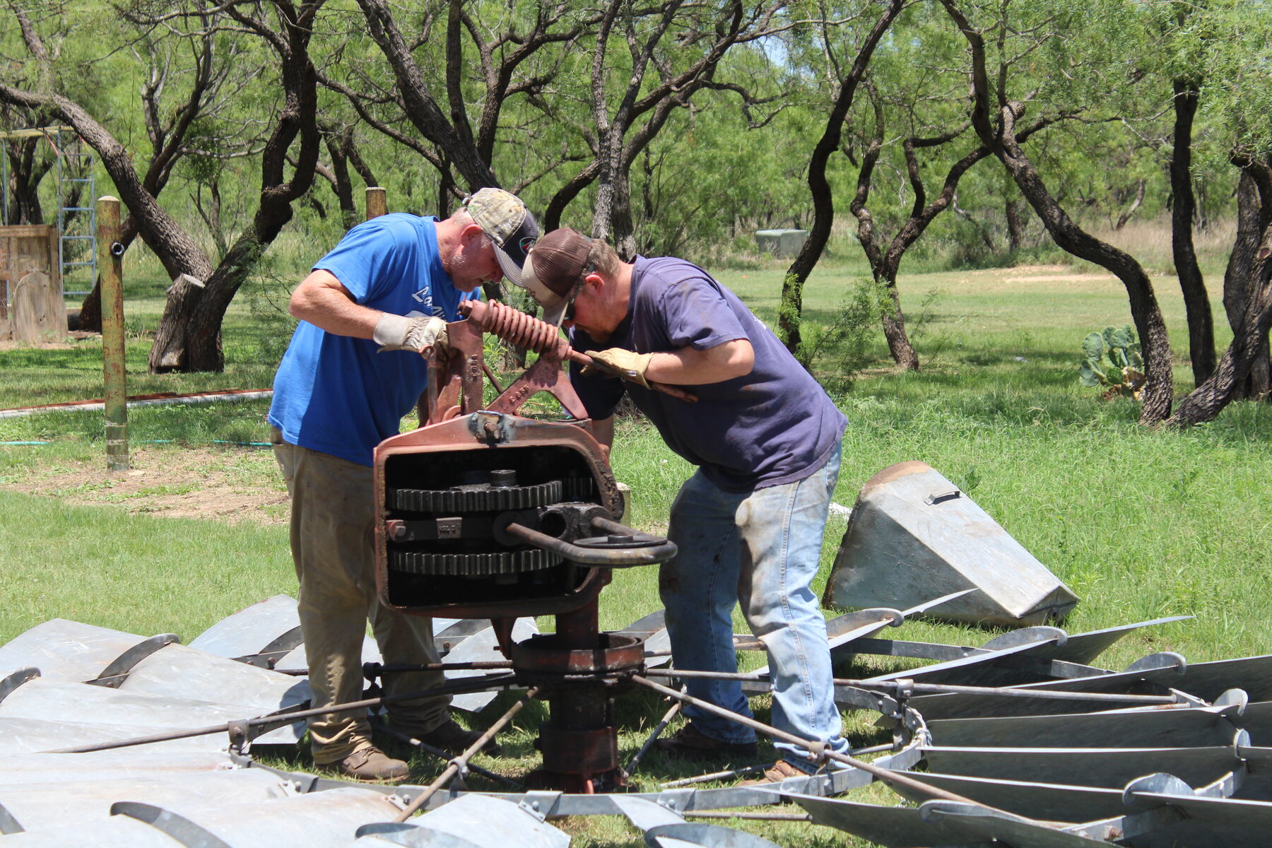 Crew inspecting windmill equipment on a Texas ranch